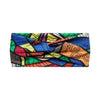 A close-up of a bohemian vintage print bandana or headband featuring colorful geometric and abstract patterns.