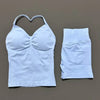 A light blue women's seamless backless fitness set top and matching bottoms displayed on a neutral background.
