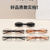 A collection of five pairs of retro oval sunglasses in various metal frames and tinted lenses displayed on a white surface.