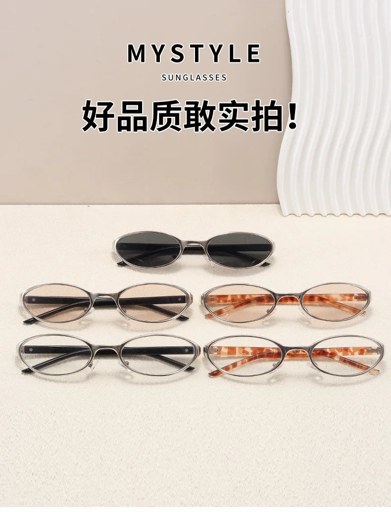 A collection of five pairs of retro oval sunglasses in various metal frames and tinted lenses displayed on a white surface.