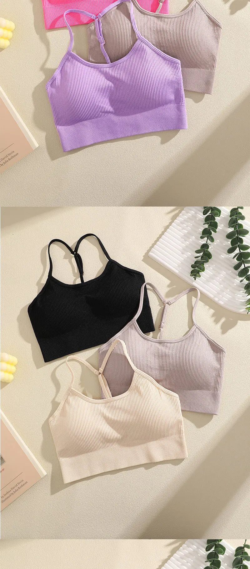 A collection of ribbed crop tops in purple, beige, and black laid out on a light surface.