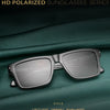A pair of silver-framed polarized sunglasses resting on a dark green fabric background.