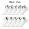 Ten pairs of white ankle socks displayed in a row.