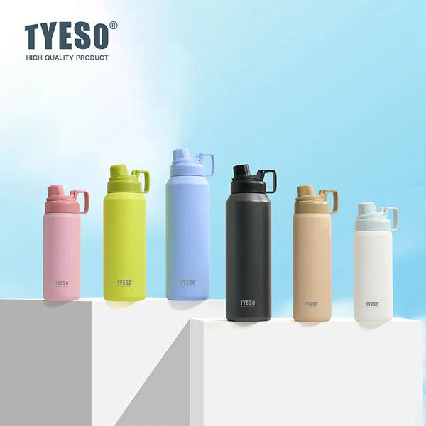 A collection of various colored insulated stainless steel thermos cups displayed on a white surface.