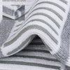 Close-up of soft cushion socks with gray and white stripes, showing the texture and knit pattern.