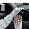 A hand wearing a white ice sleeve is placed on the steering wheel of a car, demonstrating sun protection.