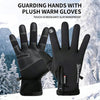 A pair of black plush warm gloves shown against a snowy mountain background.