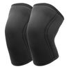 A pair of black knee sleeves for weightlifting and squats.