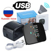 A black digital wrist blood pressure monitor device, its box, and accompanying instructions are shown next to a Russian flag.