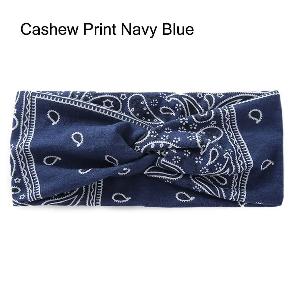Diadema de tela elástica azul marino con estampado paisley blanco