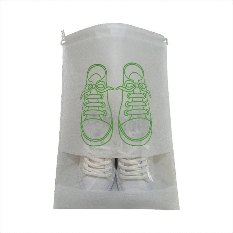 A clear non-woven shoe storage bag with a pair of sneakers visible inside.