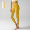 Un mannequin porte des leggings de performance jaunes taille haute.