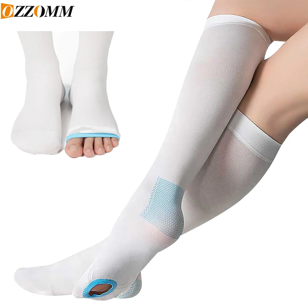 White medical-grade compression stockings being worn on a leg.