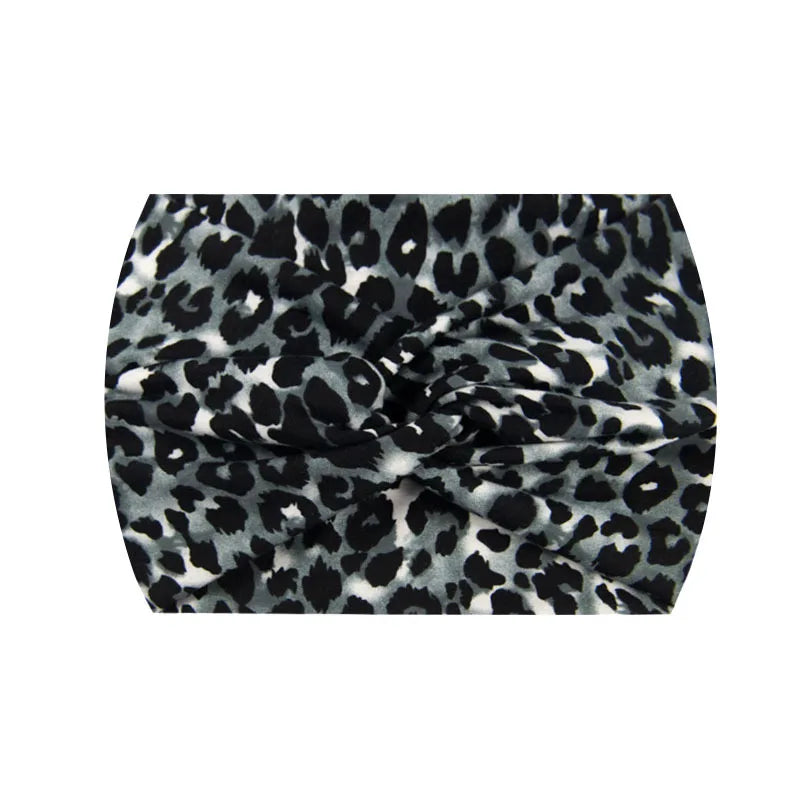A black and white leopard print wide knotted headband.