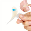 A hand is applying an invisible silicone blister patch to a foot, showing the product's shape and application.
