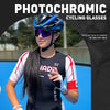 A female cyclist wearing photochromic cycling glasses with UV400 protection outdoors.