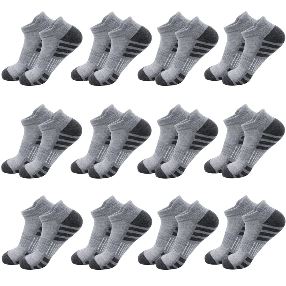 A collection of gray athletic running socks for men and women shown in various styles.