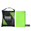A black microfiber towel bag and a bright lime green microfiber towel are displayed side by side.