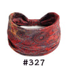 A red patterned fabric headband tied in a bow, suitable for yoga or workout.