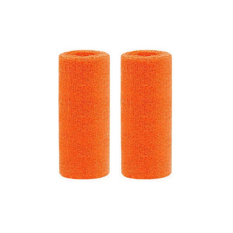 Two orange dual sports wristbands rolled up and displayed side by side.