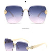 Light luxury frameless sunglasses for women with UV400 protection shown in a positive and side display.