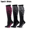 Three pairs of black compression socks with pink accents shown flat