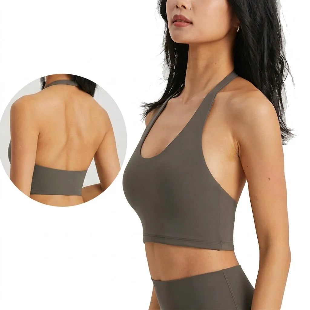 A model wearing a dark olive green halter neck sports bra top and matching bottoms, shown with a detail view of the back.
