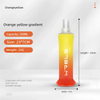 A yellow gradient liquid in a transparent bottle with an orange-colored base and white text on the side.
