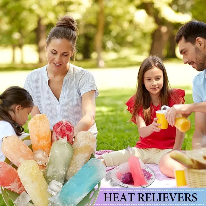 Una mujer y una niña en un parque con moldes de hielo de varios colores etiquetados como descongestionantes