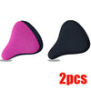 A pair of pink and black breathable 3D mesh bicycle saddle cushions.