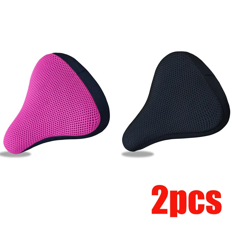 A pair of pink and black breathable 3D mesh bicycle saddle cushions.