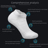 White performance running socks shown with various features highlighted, including extended lifting ear design and reinforced