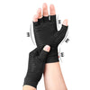 Black compression wrist support gloves being worn on a hand and wrist.