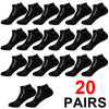 A set of twenty pairs of black mesh ankle socks displayed in a flat lay view.