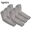 Six pairs of light gray UV protection compression arm sleeves laid out for display.