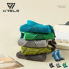 A stack of colorful five-finger compression socks in various shades of blue, green, and gray.