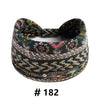A close-up of a black patterned boho cotton turban headband.