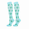 A pair of light blue compression elastic socks patterned with green cacti.