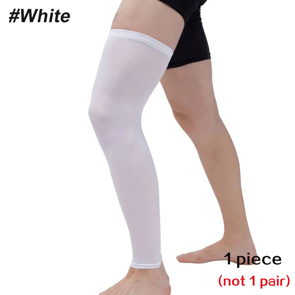 A white full leg compression sleeve worn on a person's leg.