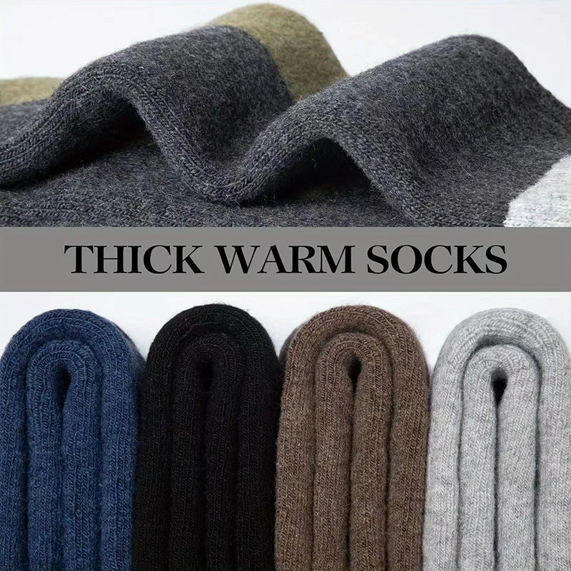 A close-up of thick warm socks in various colors including navy blue, black, brown, and gray wool texture.
