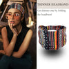 A woman wearing a patterned thinner headband on her head, with a folded headband shown below.