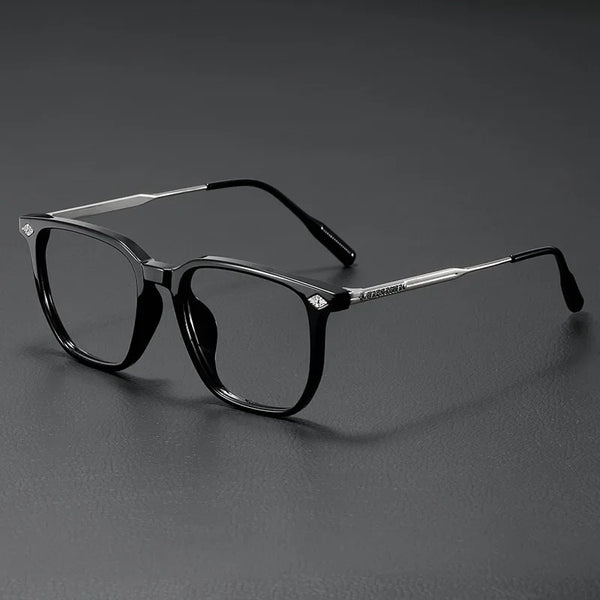 A pair of black retro anti-blue light glasses resting on a dark surface.