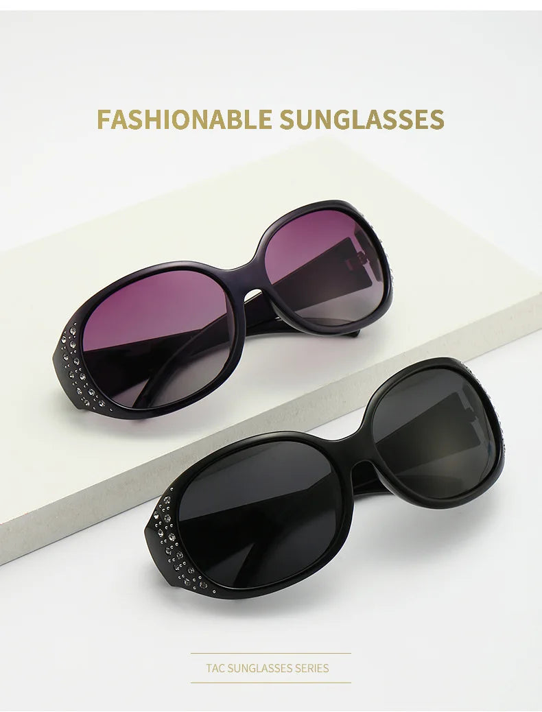 A pair of black sunglasses with diamond-inlaid detailing displayed on a white surface.