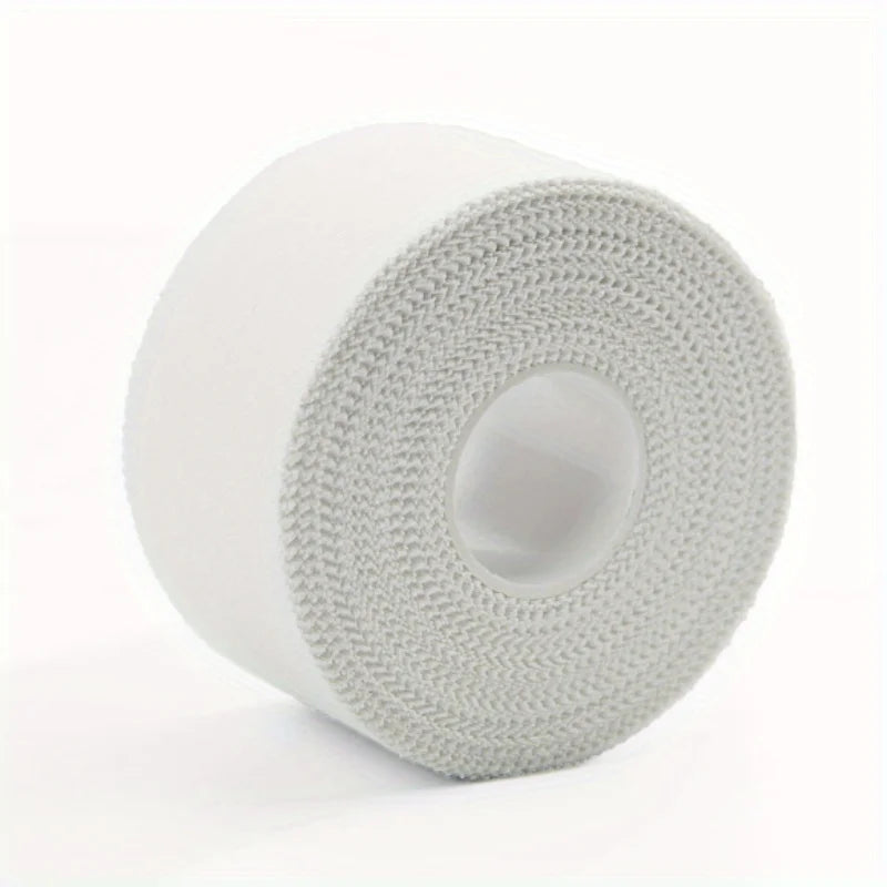 Roll of gray athletic training tape with a white core and visible woven texture.