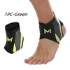 A black and neon green ankle compression strap is shown wrapped around a person's foot and ankle.