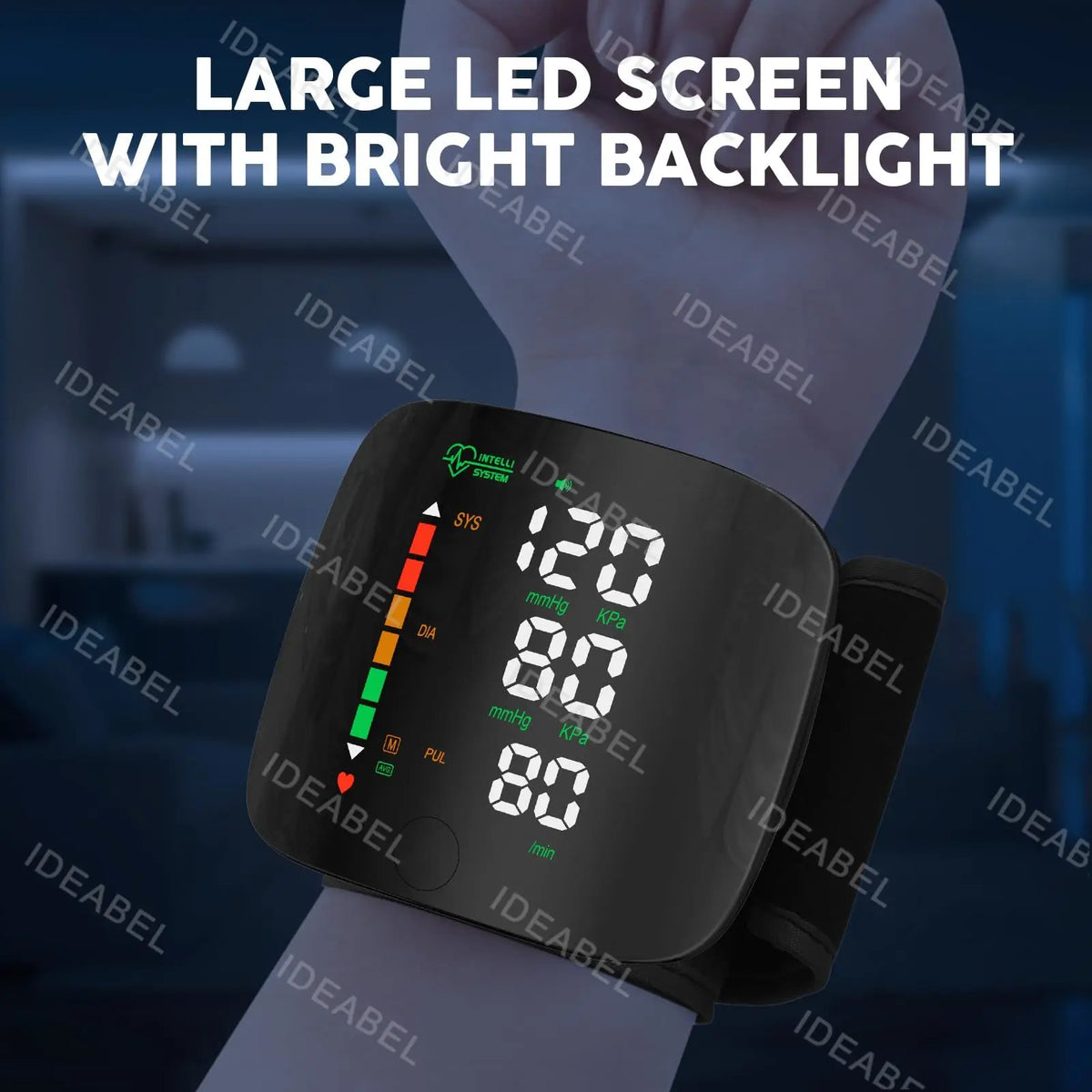 A hand is wearing a black digital wrist blood pressure monitor with a bright backlit screen displaying 80/80 mmHg.