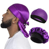 A man wearing a purple silky durag pirate headband and a white shirt, with separate headbands shown.
