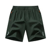 Dark green men's lightweight quick-dry running shorts shown flat lay