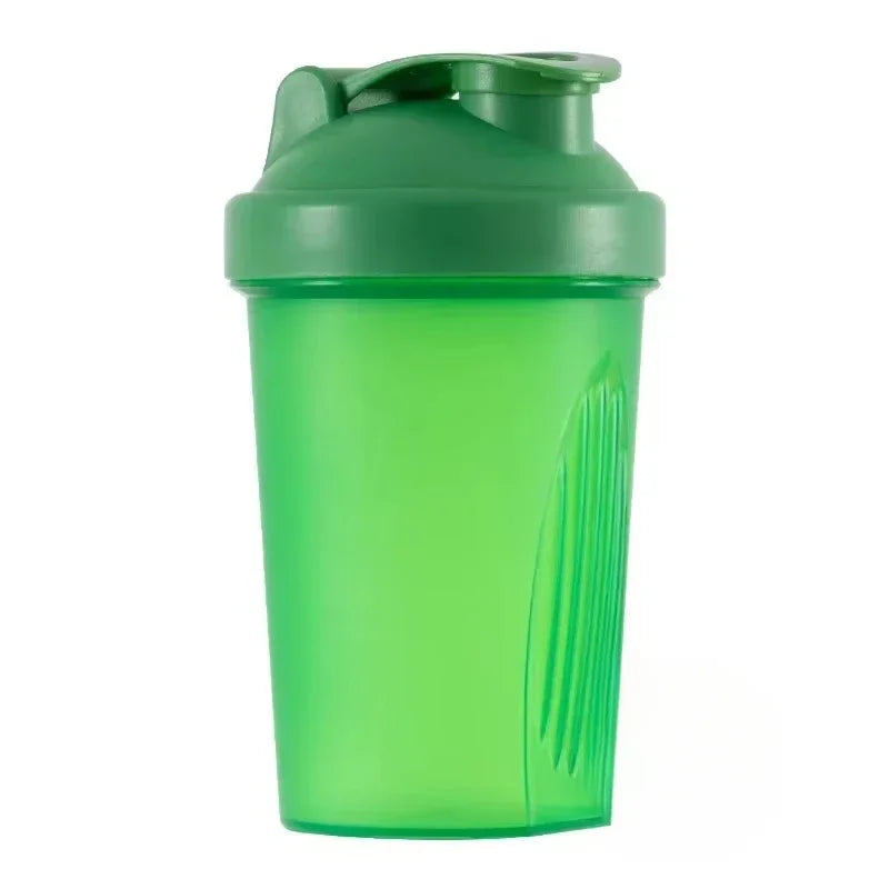 A green portable protein shaker bottle with a sealed cap.