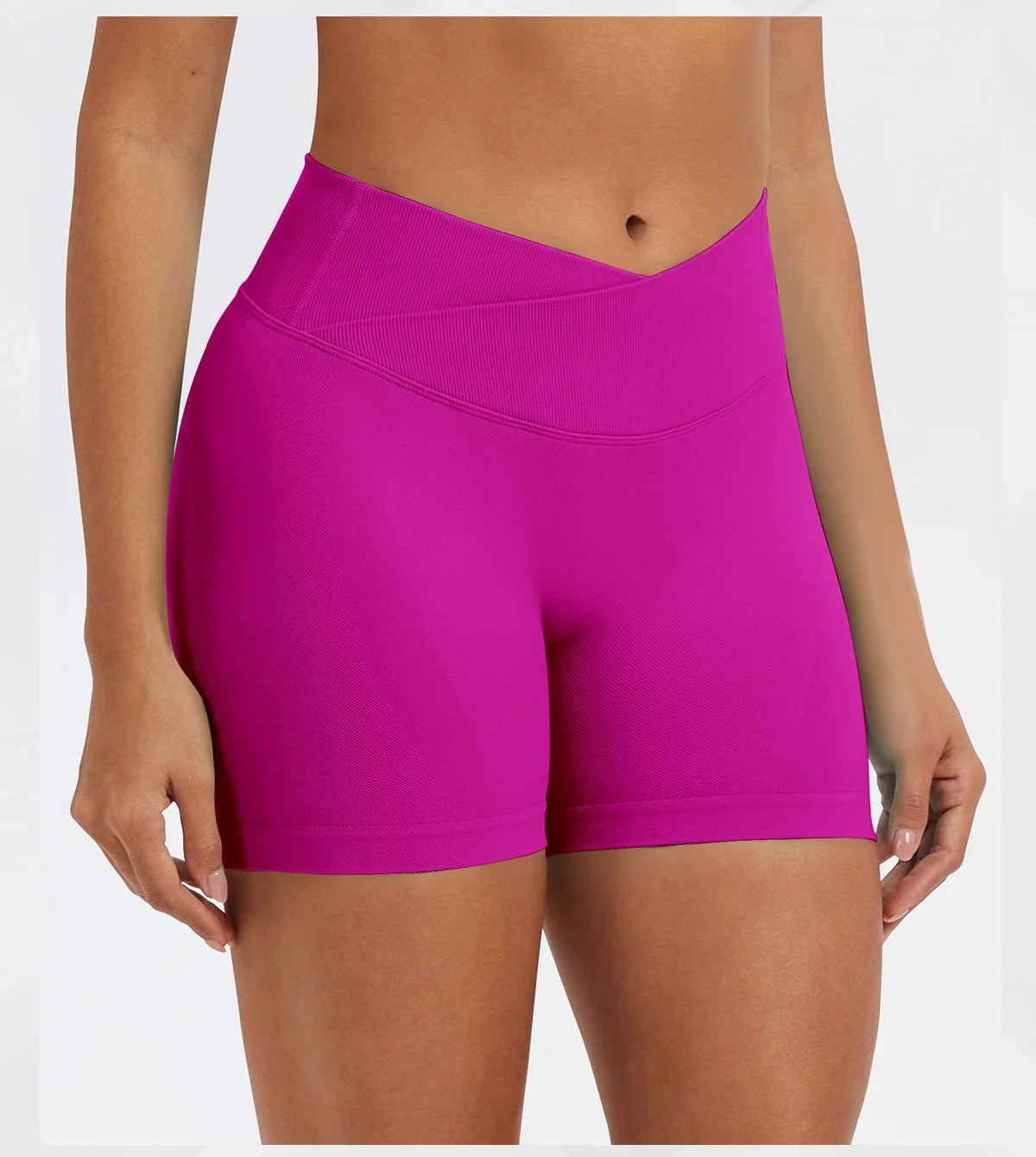 A model wearing bright magenta seamless high-waist yoga leggings.